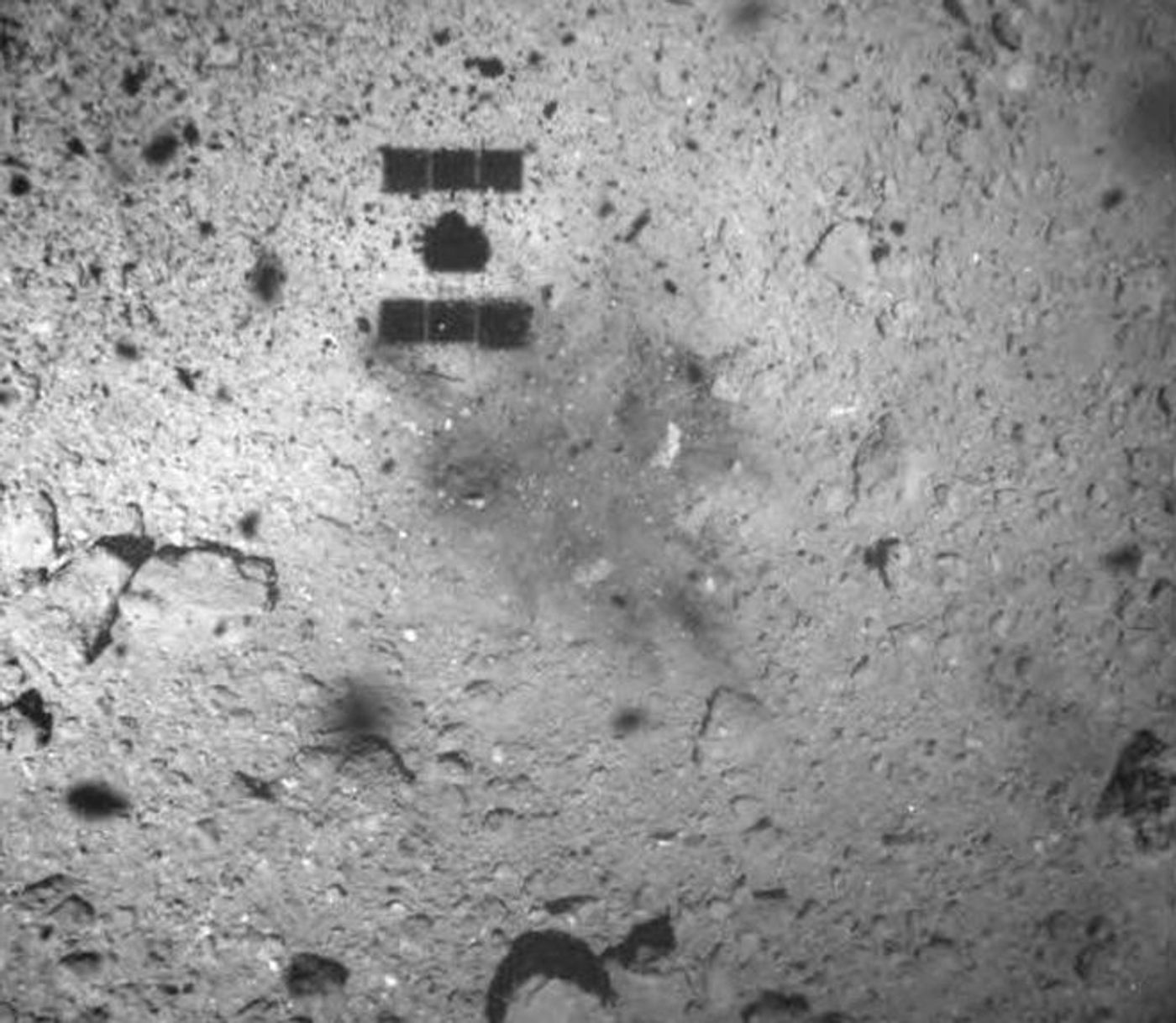 The 'dark spot' left behind by the Hayabusa-2 spacecraft.