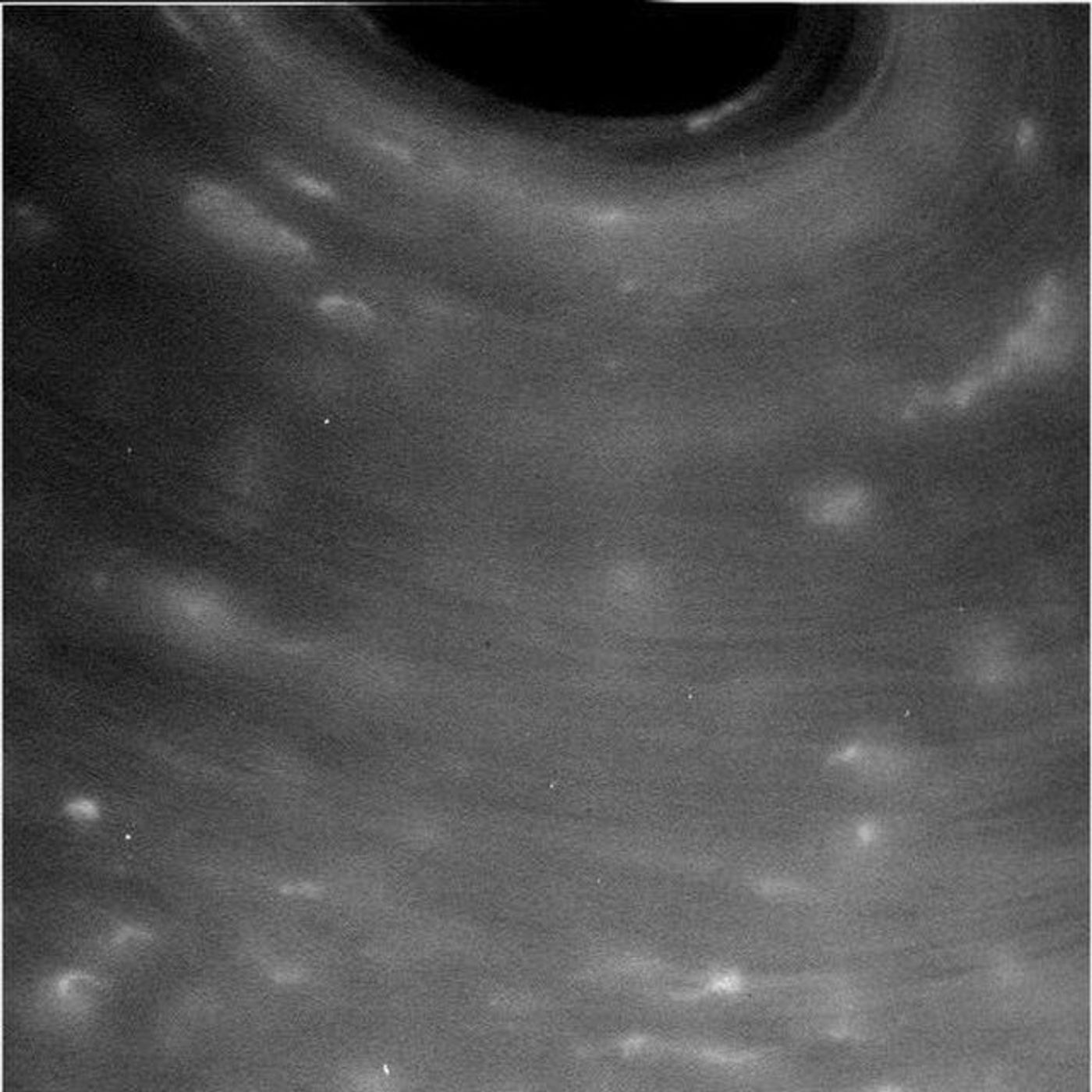 Saturn's atmosphere has lots of detailed streaks and striations that scientists hope to study at a future date.