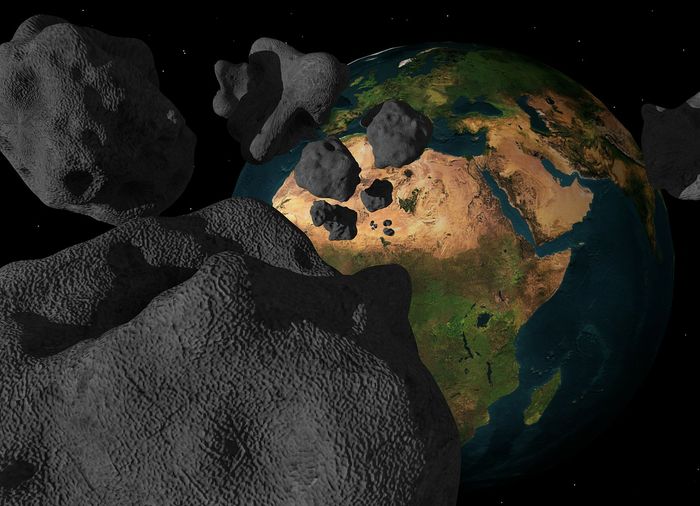 An artist's rendition of a hazardous asteroid breaking up before slamming into Earth.