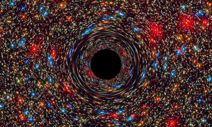 An artist's impression of a black hole's powerful gravitational grip on everything surrounding it.