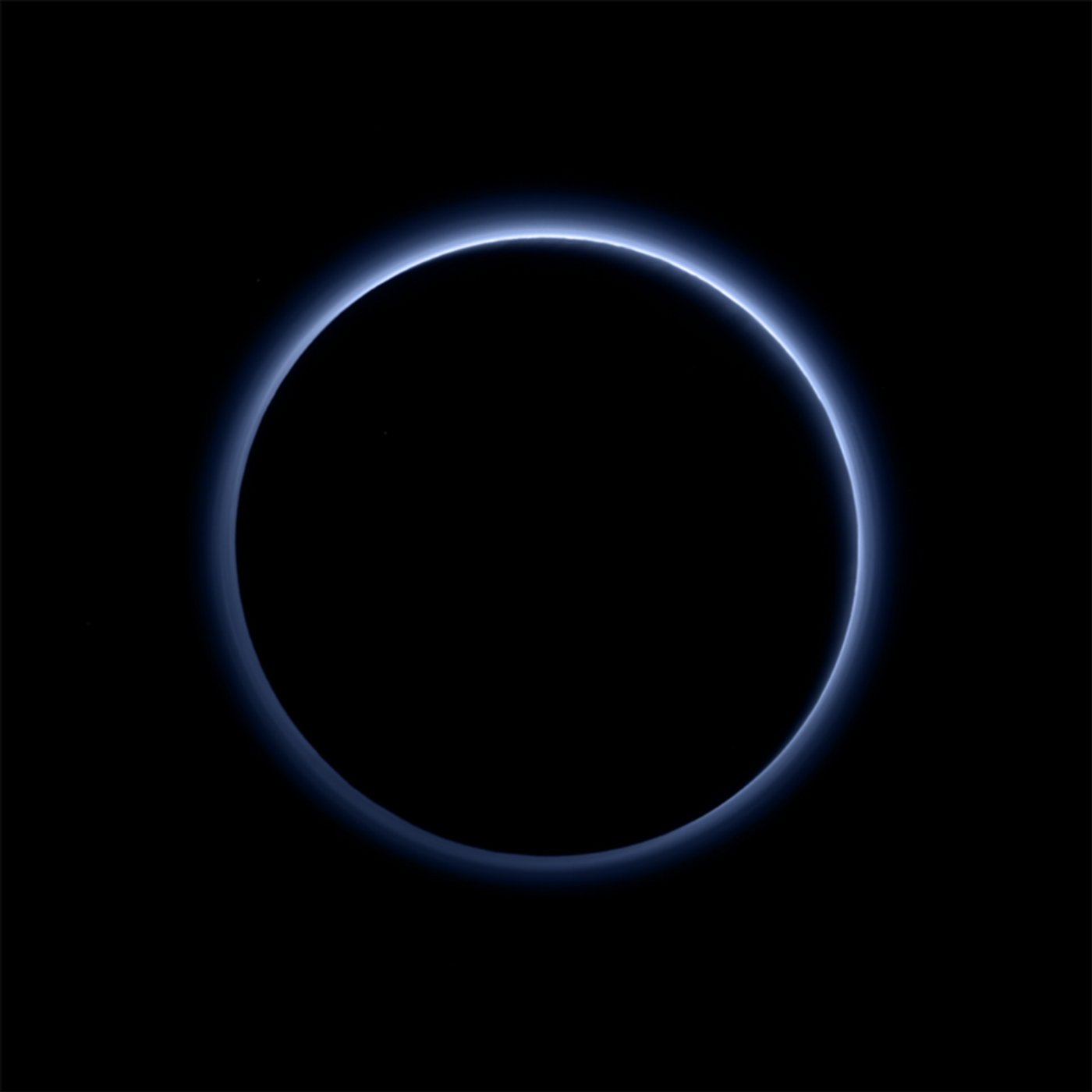 Pluto's atmosphere gives off a blue haze.
