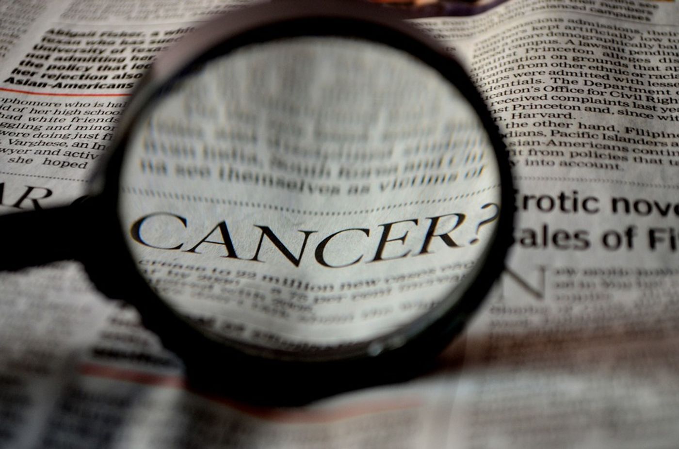 Cancer in newspaper image, credit: public domain