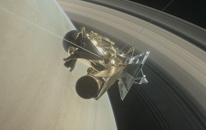 An artist's impression of the Cassini spacecraft flying in between Saturn and its rings to make observations.