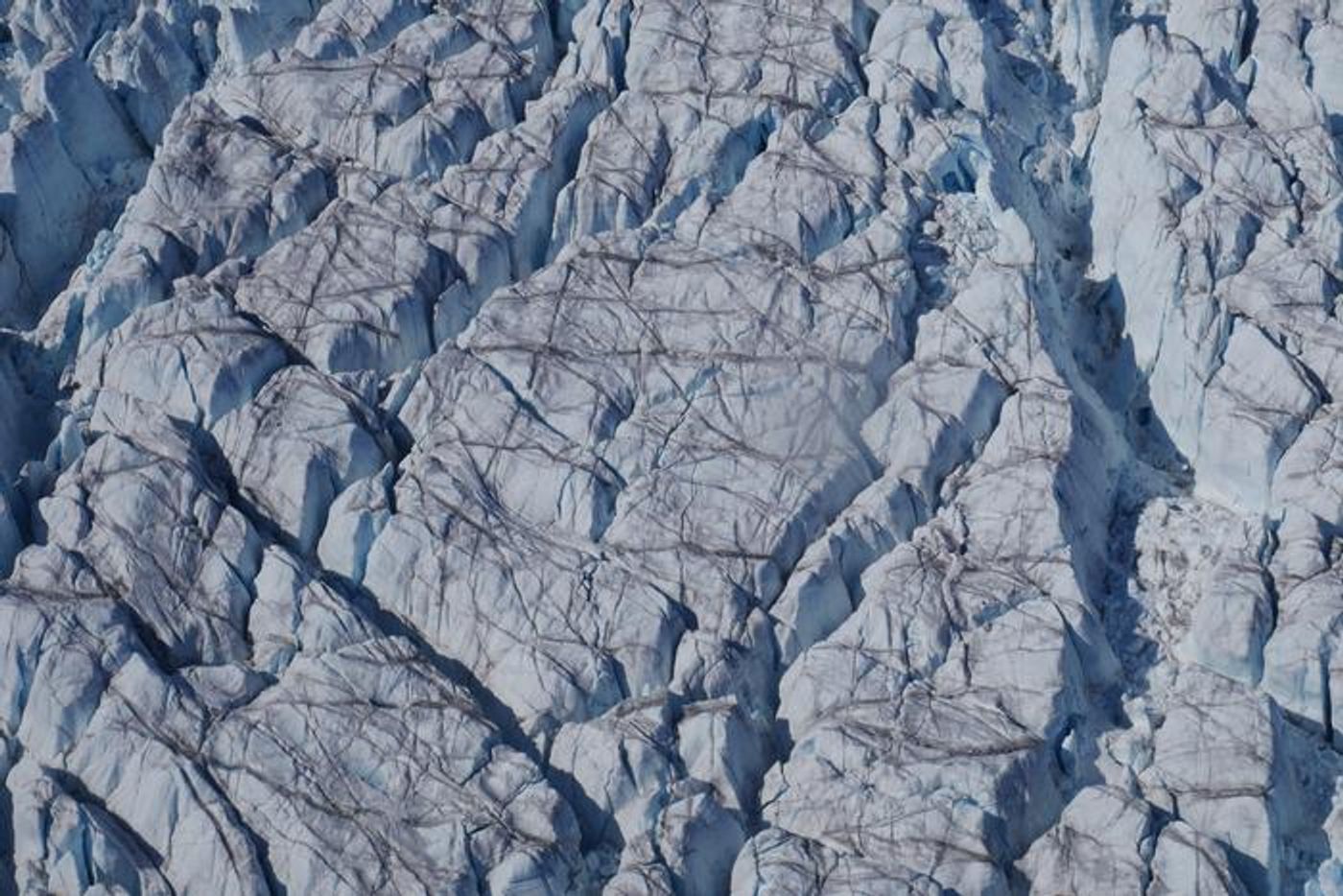 Crevasses at Store Glacier, a marine-terminating outlet glacier of the western Greenland Ice Sheet. / Credit: Tom Chudley (Durham University)