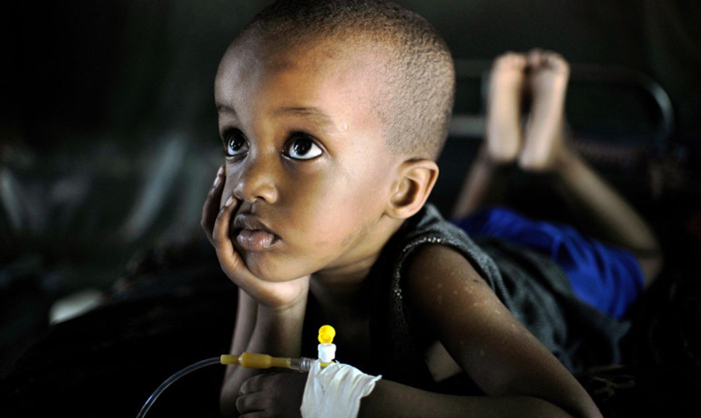 "The thing about malaria is that really, really poor people have it, so the medicine has to be very inexpensive," says Spencer Knapp. "We think that ours is going to be inexpensive." Above: Mohammed, suffering from Malaria, recovers at a Burundian run clinic in Somalia's capital, Mogadishu.