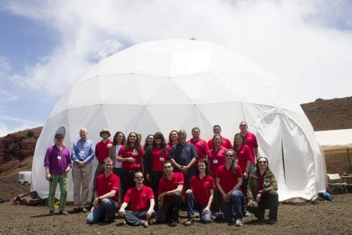 The team gathers in front of the dome on Mauna Loa. Photo: hawaiitribune-herald.com