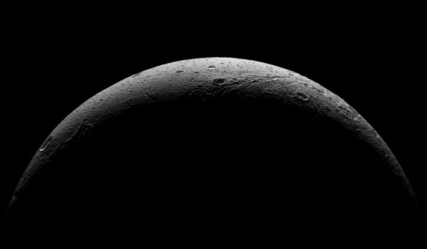 Is the surface of Dione hiding an ocean underneat like other moons orbiting Saturn?