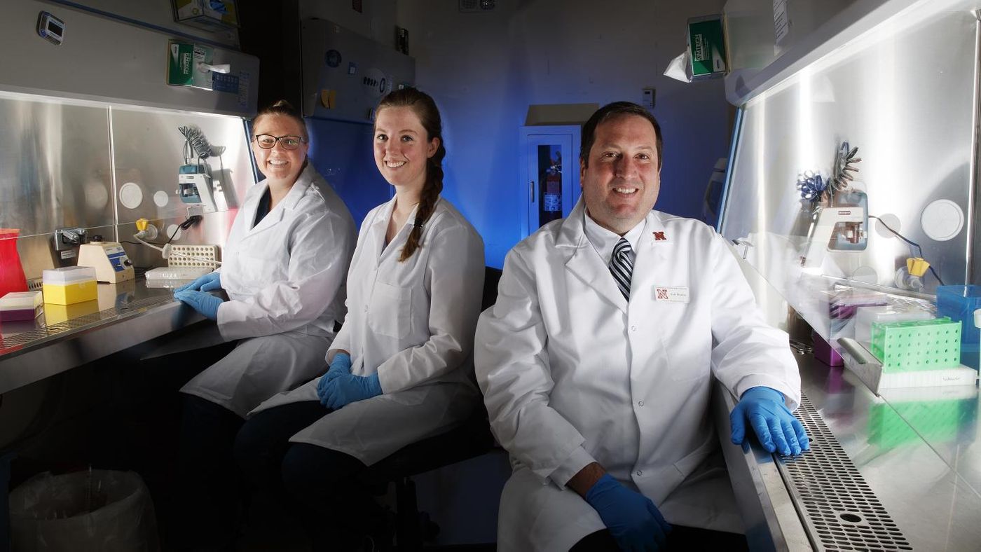 Eric Weaver (right), an assistant professor in the School of Biological Sciences at the University of Nebraska-Lincoln, and research team members Brianna Bullard (center) and Amy Lingel (left). / Credit: Craig Chandler/University Communication/University of Nebraska-Lincoln