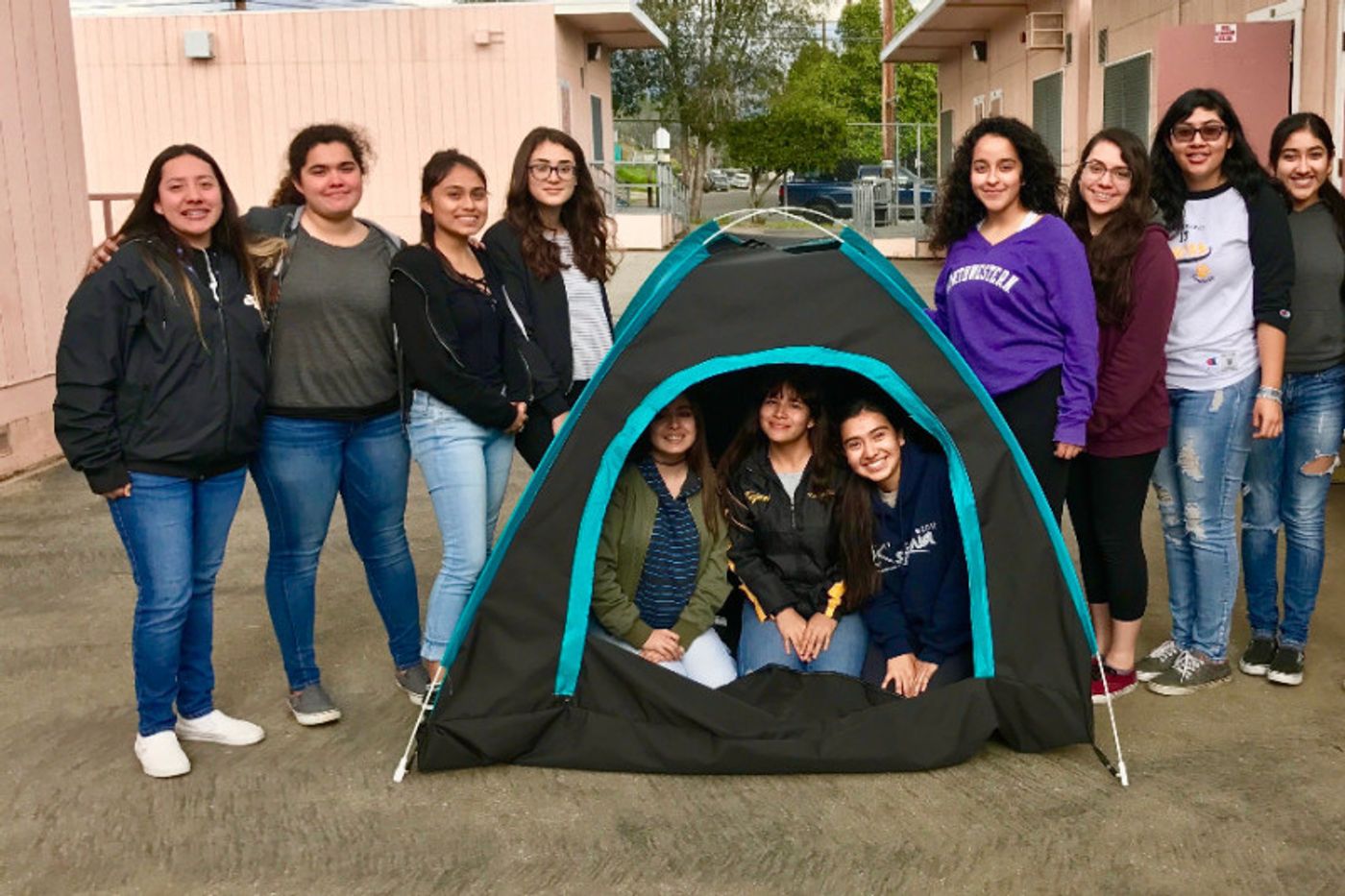 The girls show off their solar-powered tent. Source: GoFundMe