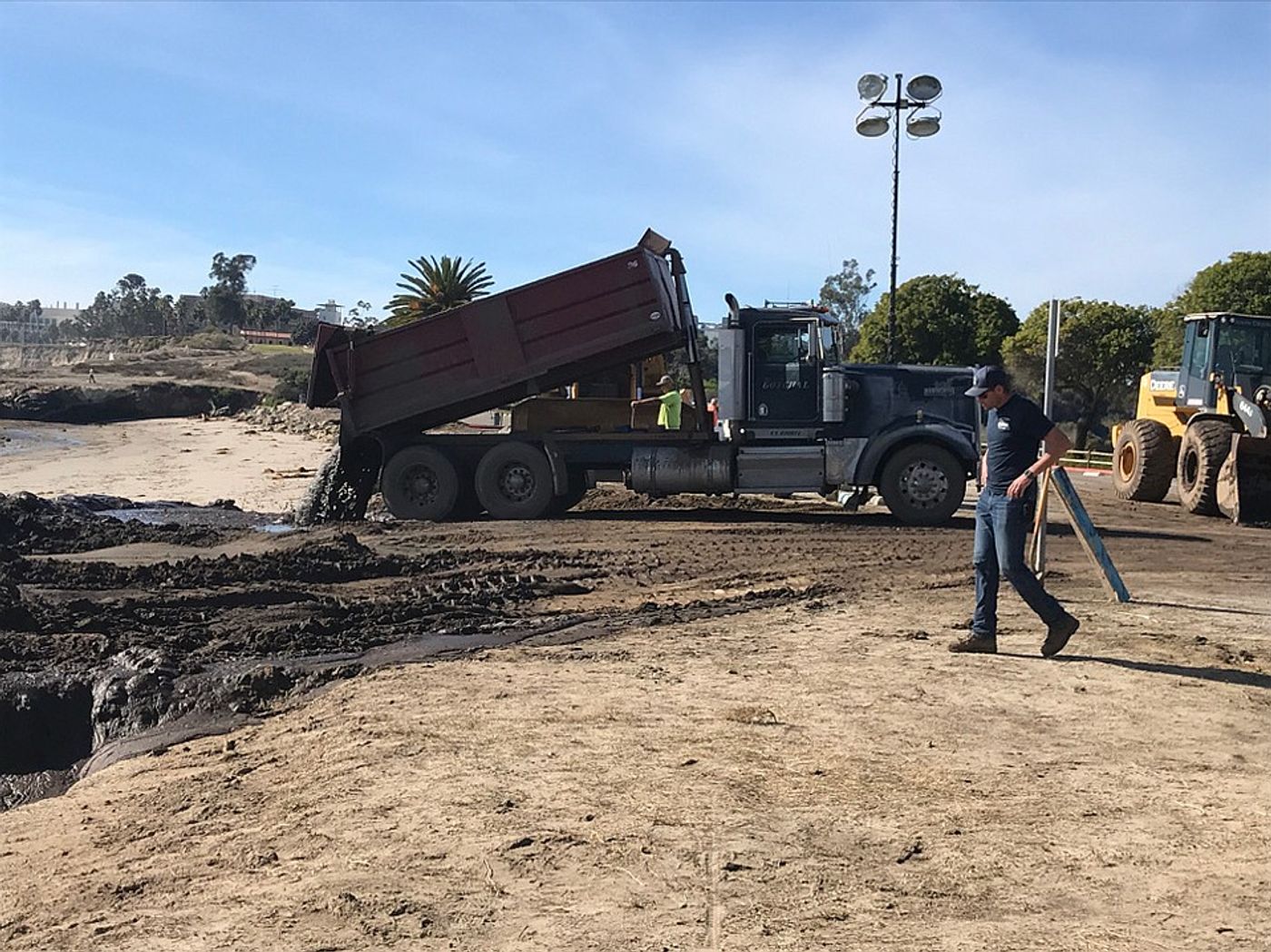 A truck dumps mud onto Goleta Beach. Photo: The Santa Barbara Independent
