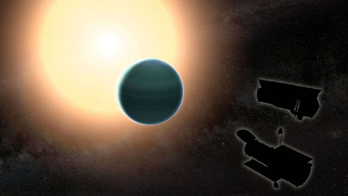 An artist's impression of HAT-P-26b while it transits its host star - both the Hubble Space Telescope and Spitzer Space Telescope appear as silhouettes in the bottom right corner.