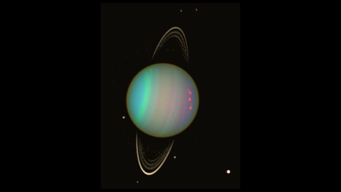 A false-color image of Uranus and its rings as captured by the Hubble Space Telescope.