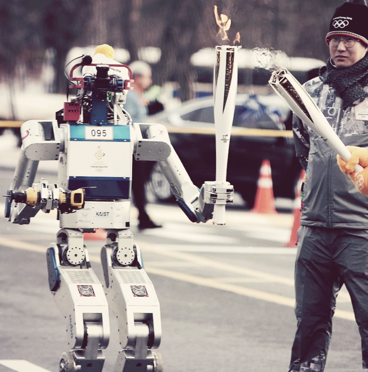 HUBO the robot receives the Olympic flame, credit: still from On Demand News, YouTube