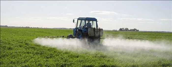 A tractor spray dicamba pesticides on crops. Photo: Farm Futures
