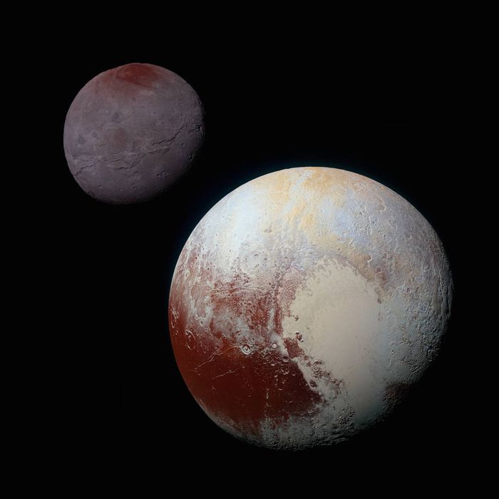 Here we see Pluto (right) and its largest moon Charon (left).