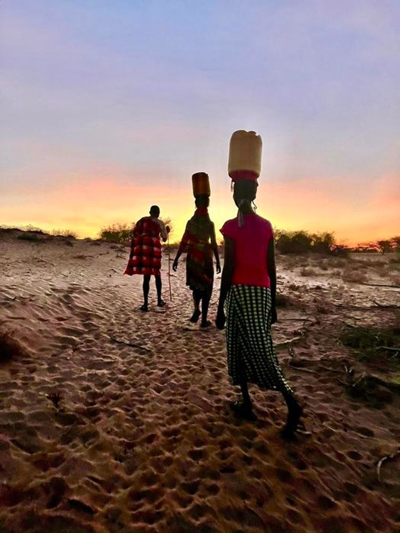 Members of Kenya's Turkana community often walk miles each day in scorching heat to collect water for their animals and personal consumption. / Credit: Sebastian Michel Mata