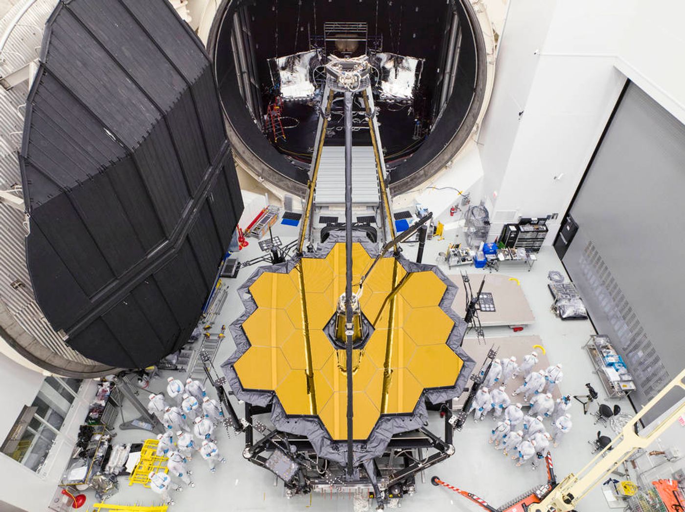 NASA engineers stand by the James Webb Space Telescope's heart in front of Chamber A.