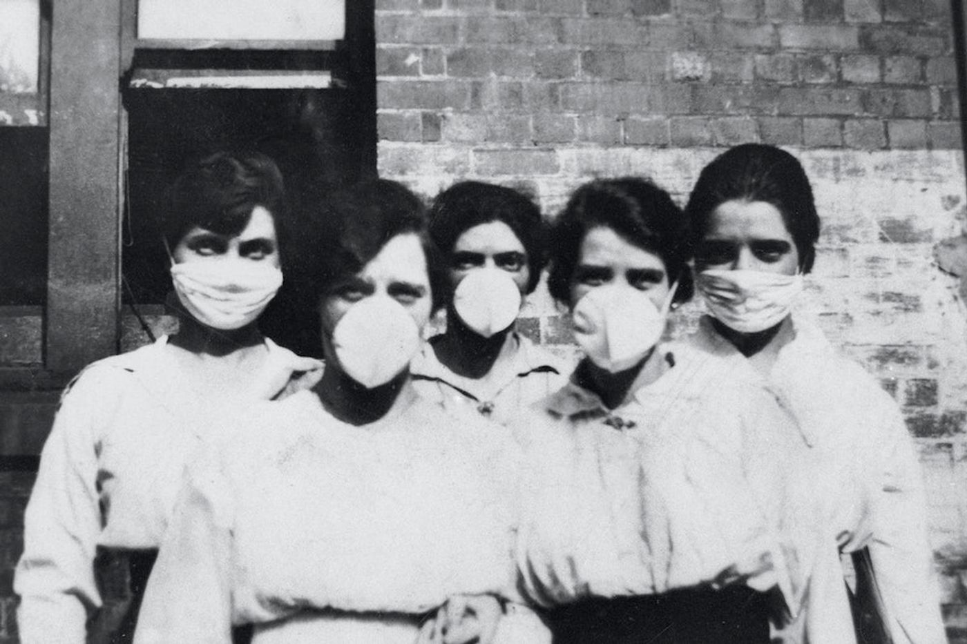 Women wearing surgical masks during the influenza epidemic, Brisbane (1919). Original image from State Library of Queensland. / Credit: Rawpixel/Free public domain CC0 image 