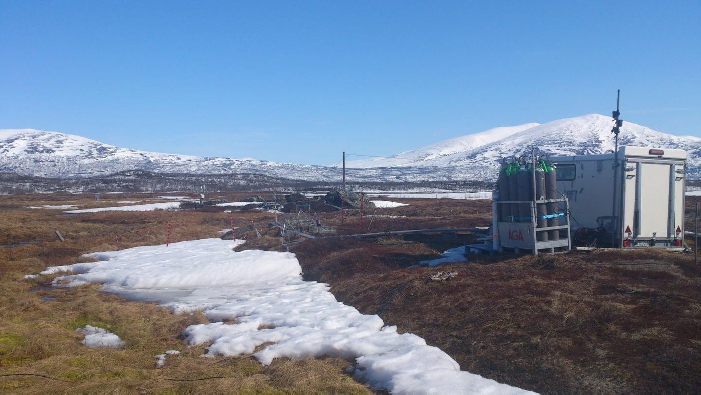 Stordalen Mire study site. The biogeochemistry hut is connected to autochambers, allowing measurements of gas flux. / Credit: Caitlin Singleton