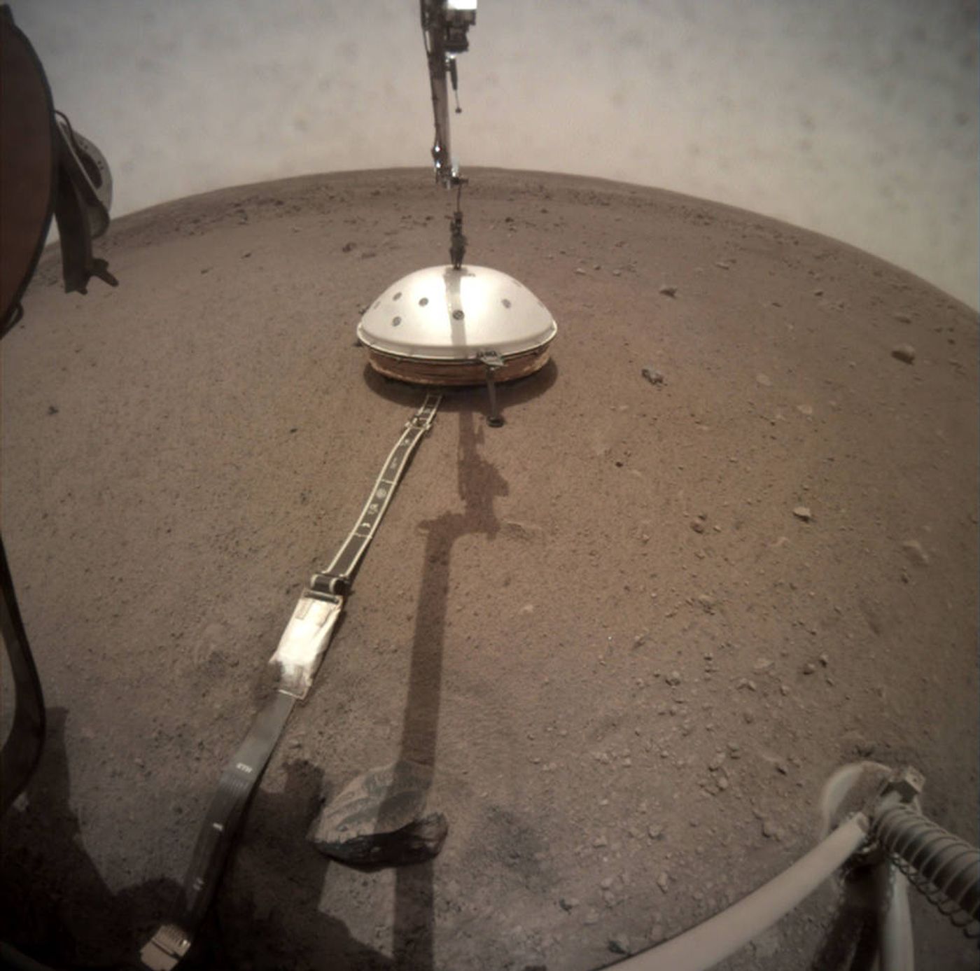 A view of InSight's SEIS instrument following the installation of its Wind and Thermal Shield.