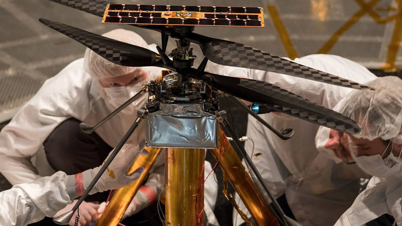 Engineers worked on the Martian helicopter before deploying the first test flight.