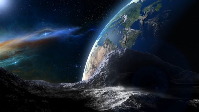 An artist's impression of a large asteroid passing by the Earth.