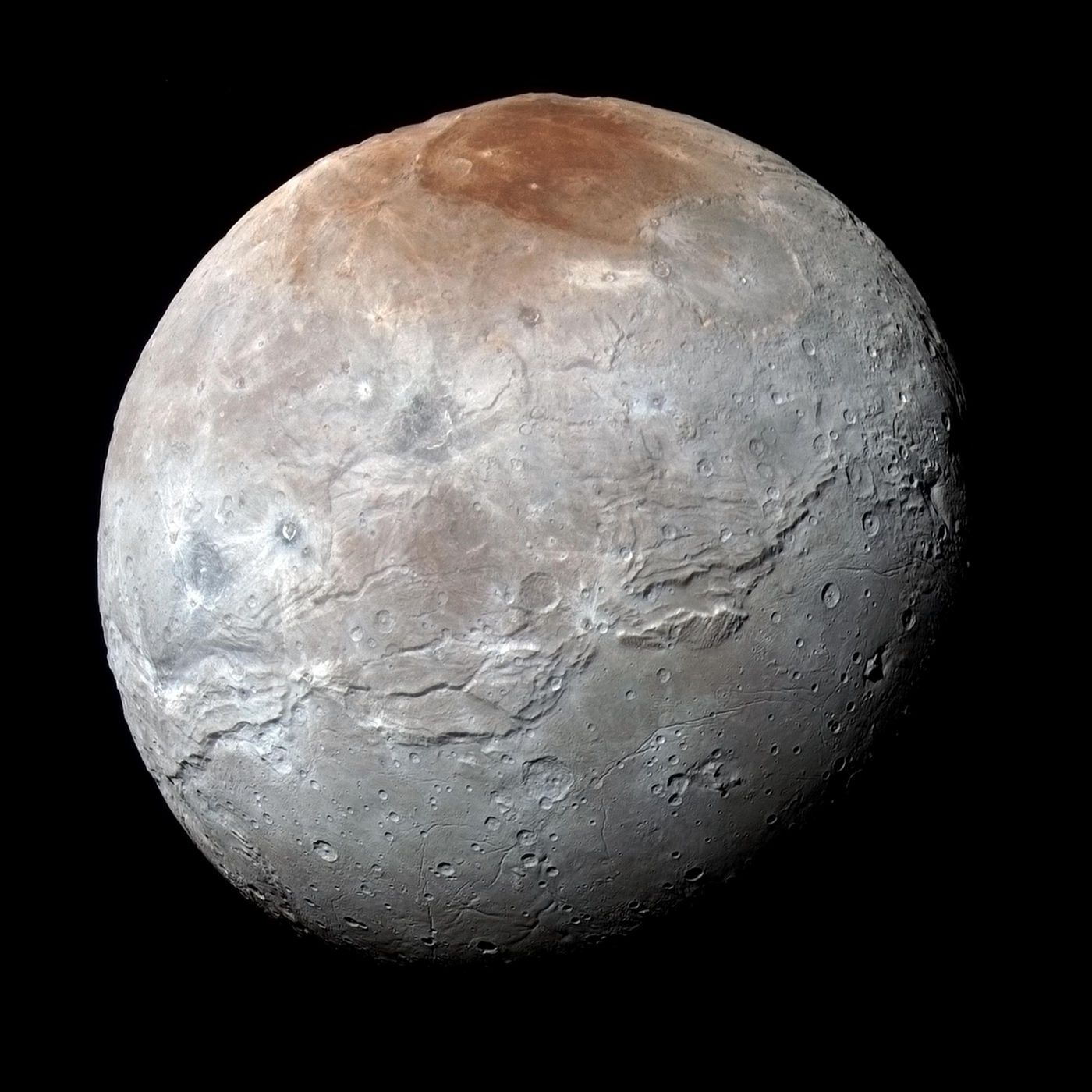 Where did that distinctively-colored red spot at the top of Charon actually come from? Scientists think they've figured it out.