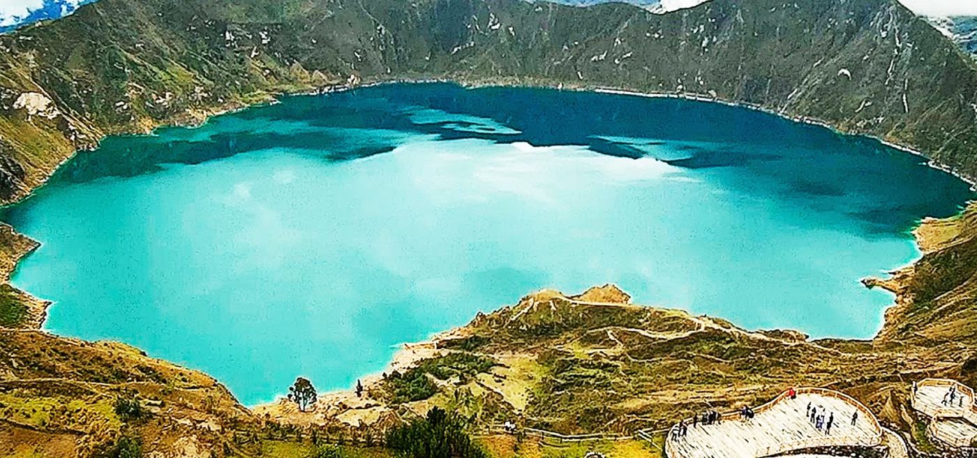 Shadows of clouds on the lake make its coloring even more impressive. Here you can also see the travertine deposits on the edge of the lake. Photo: Pacha Journeys