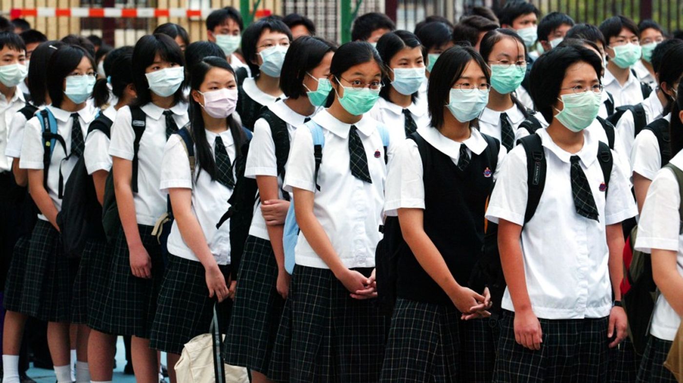 Students wear masks during a SARS outbreak. South China Morning Post