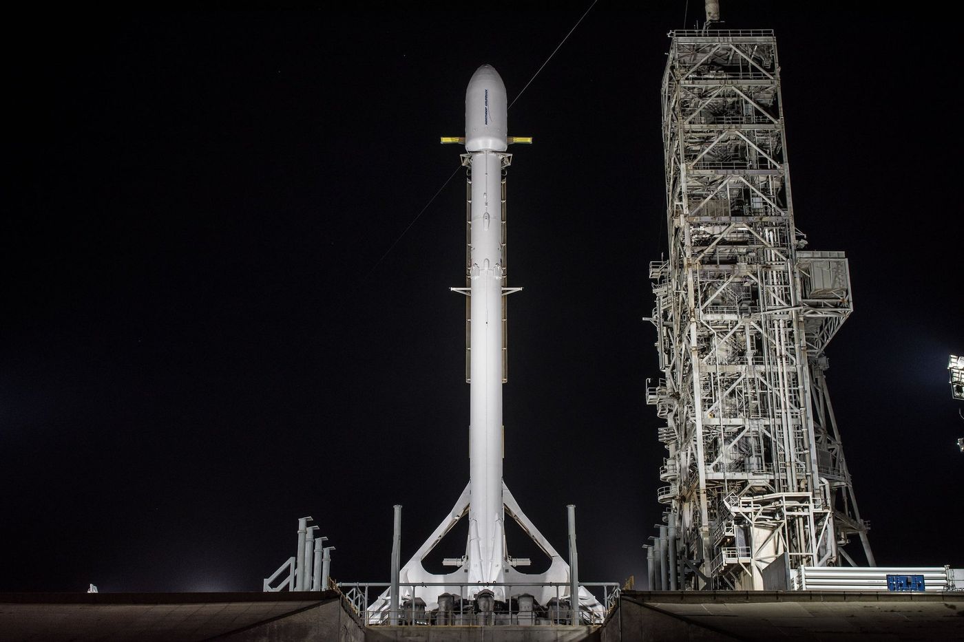 A SpaceX Falcon 9 rocket stands upright at NASA's Kennedy Space Center while carrying the top-secret Zuma payload.