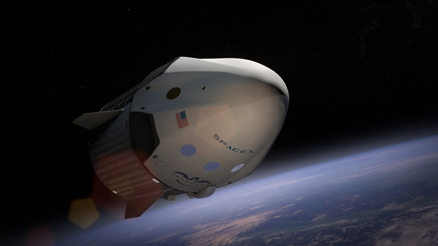An artist's rendition of a SpaceX capsule floating in space above the Earth.