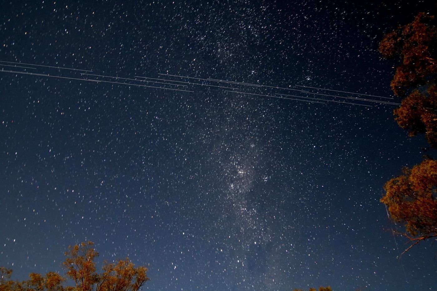 This an image of the sky taken from Arkaroola, South Australia. You can see SpaceX Starlink satellites streaking through the image. Credit: Padraic Koen.