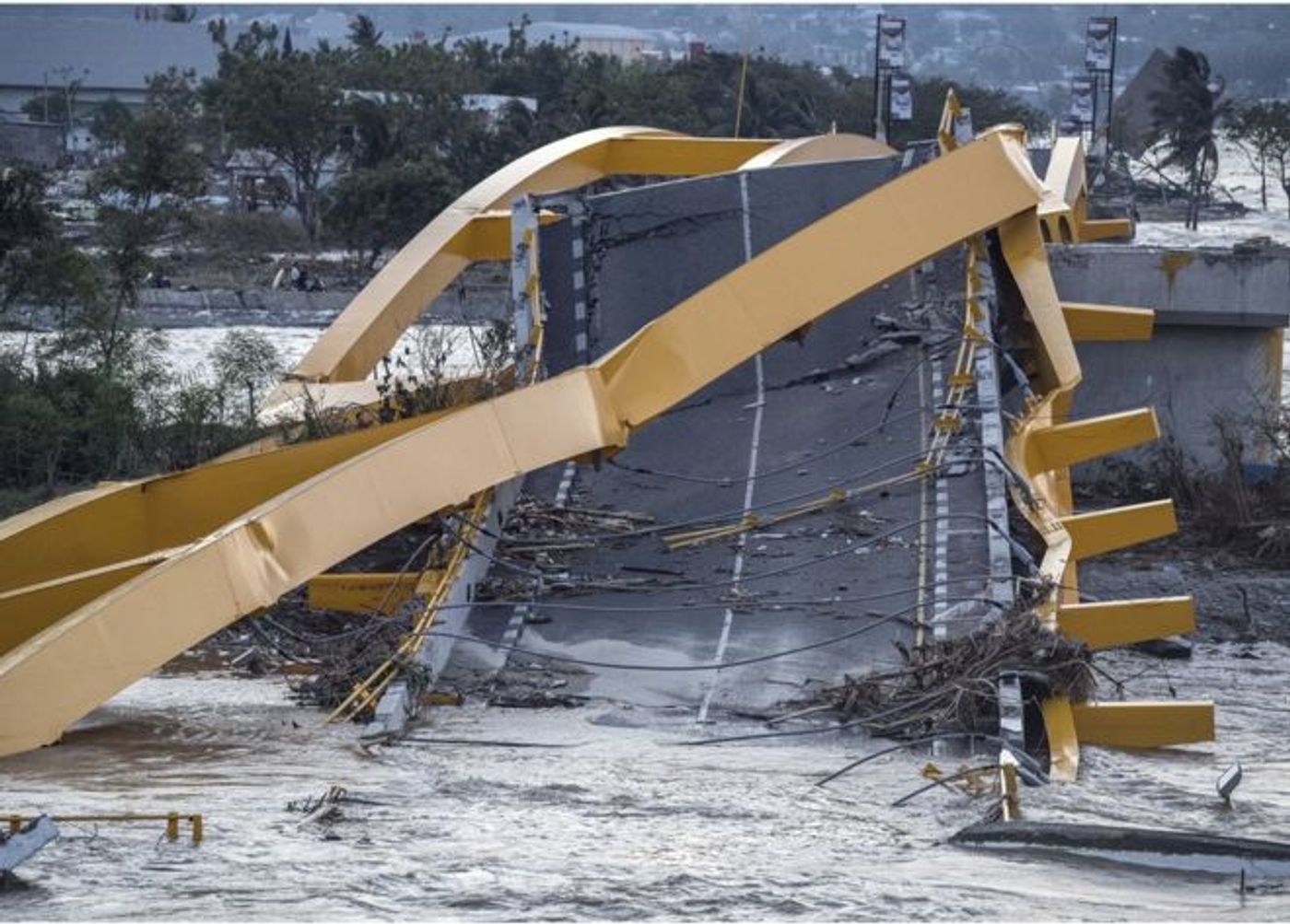 The tsunami left devastation amidst the island. Photo: The Guardian via AFP