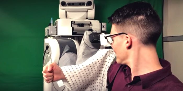 Robot Learns to Put Hospital Gowns on Patients