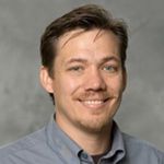 Biophysical Modeling Suggests an Evolutionary Pathway Linking Cytokinesis, Cell Migration, and Axonal Elongation